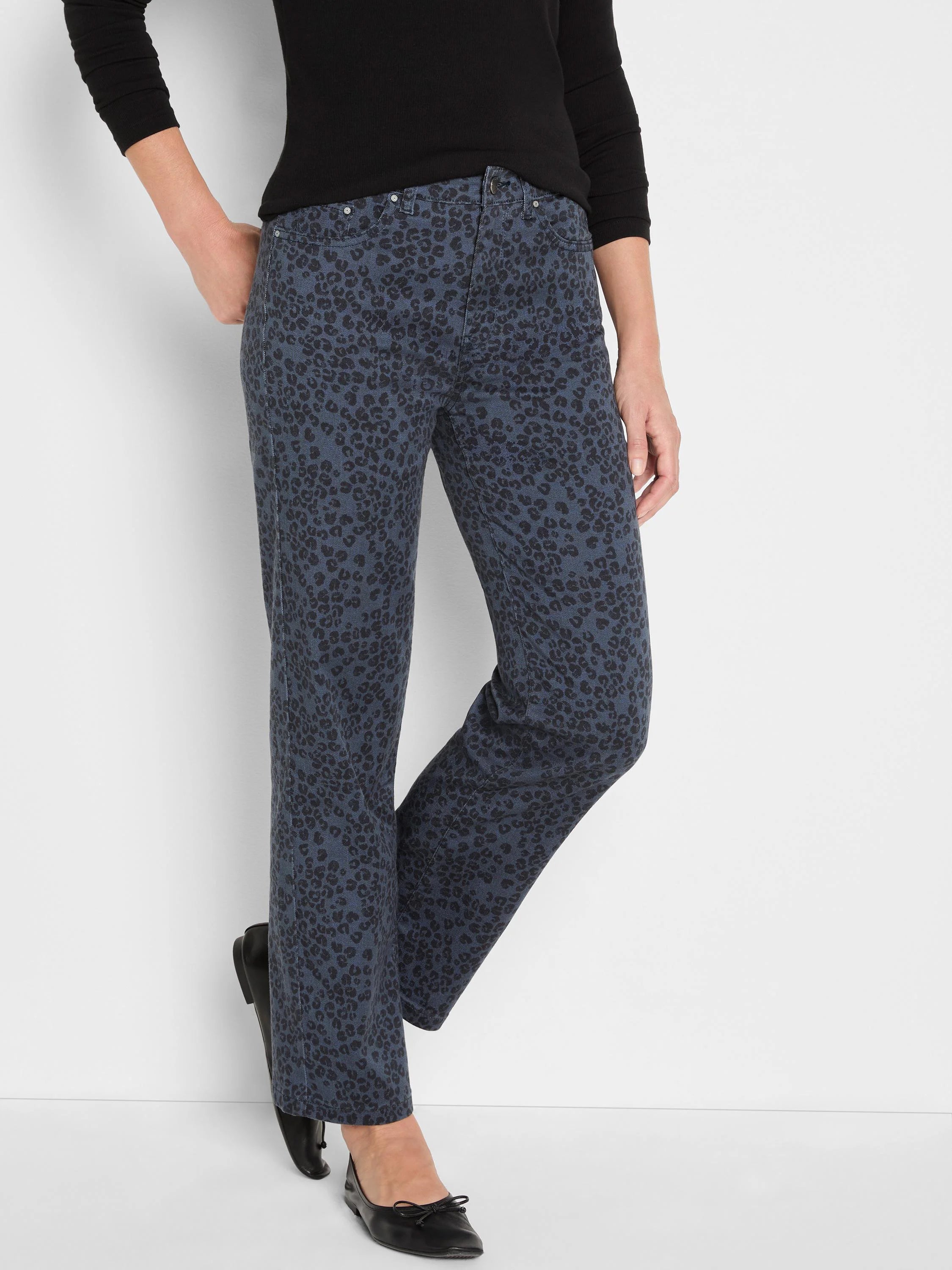 Dark blue straight ankle jeans with an all-over black leopard print.