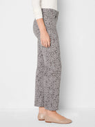 Grey-brown straight ankle jeans with light grey leopard print.