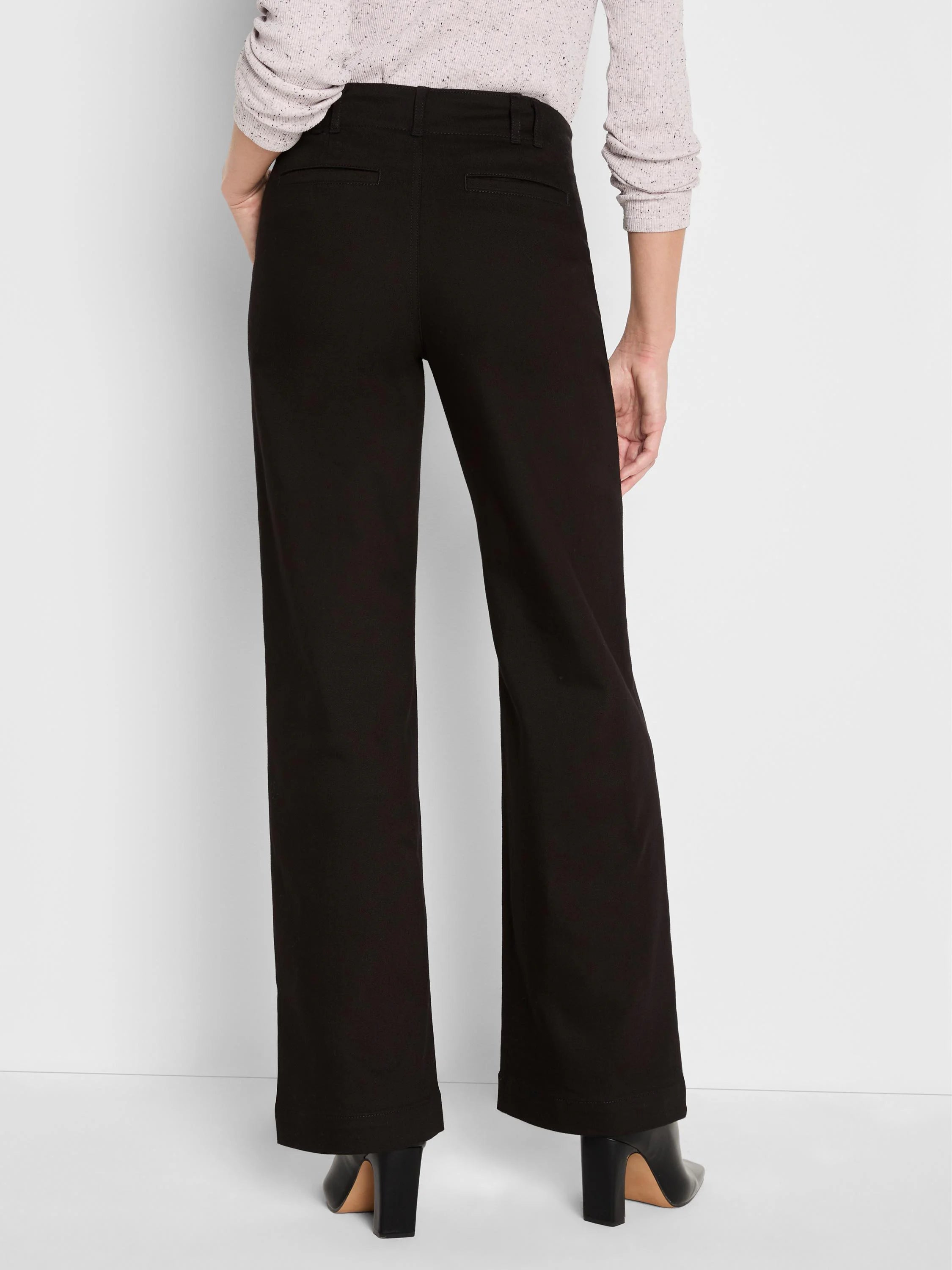 Black wide-leg trouser jeans, model from behind. Features waistband with belt loops & two back welt pockets.
