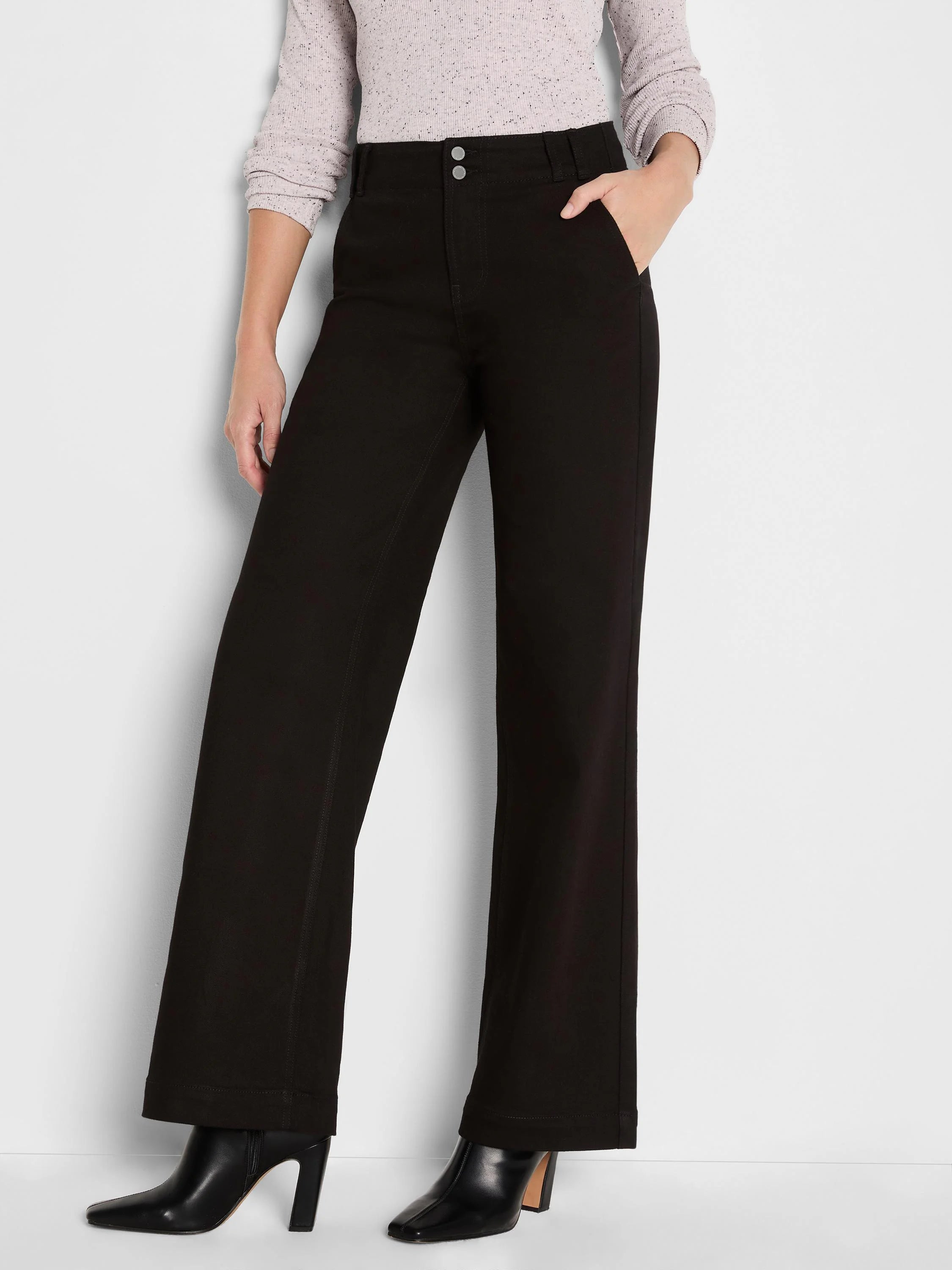 Black wide-leg trouser jeans with a high waist, two silver buttons, and belt loops.