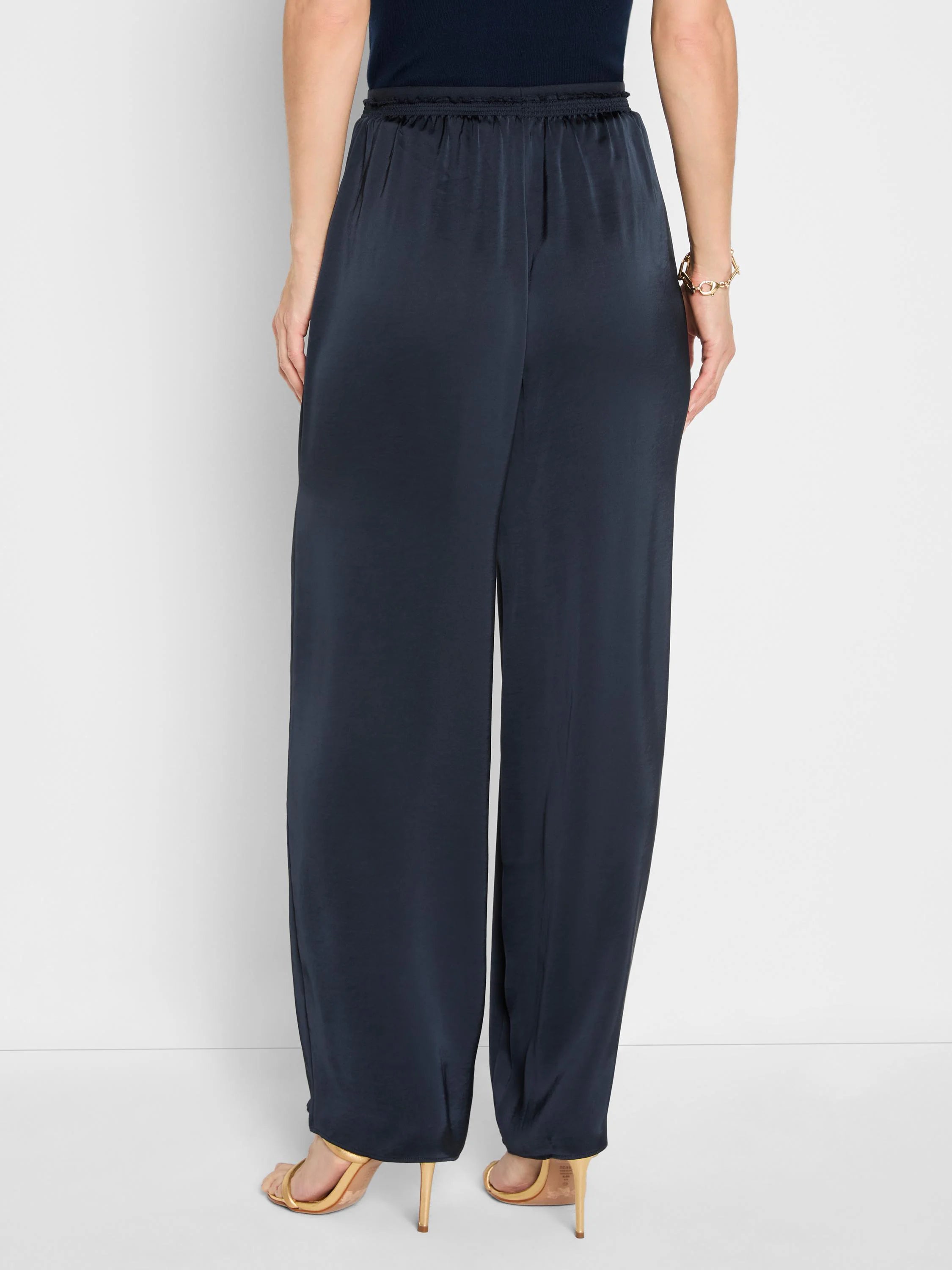 Navy wide-leg pull-on pants with an elasticated waistband and a subtle glossy finish, shown from the back.