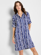 Relaxed blue and white tie-dye shift dress with short sleeves, a pointed collar, and convenient hidden pockets.