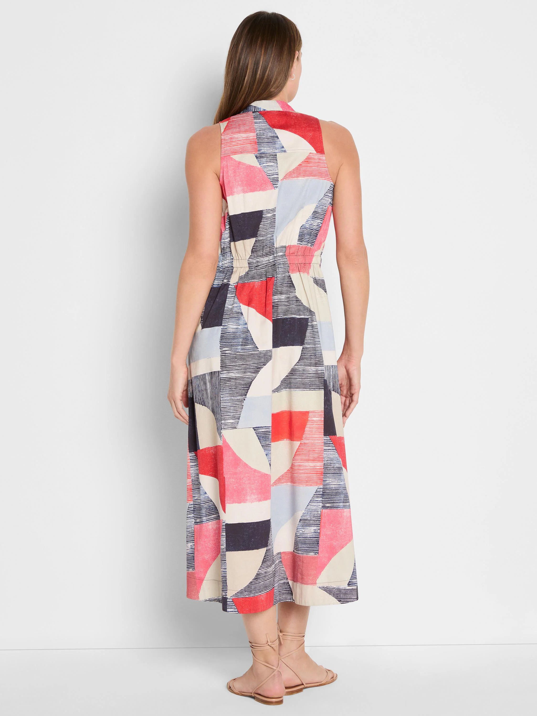 Sleeveless midi dress with collared neck, elastic waist. Abstract geometric pattern in red, navy, light blue, and beige.