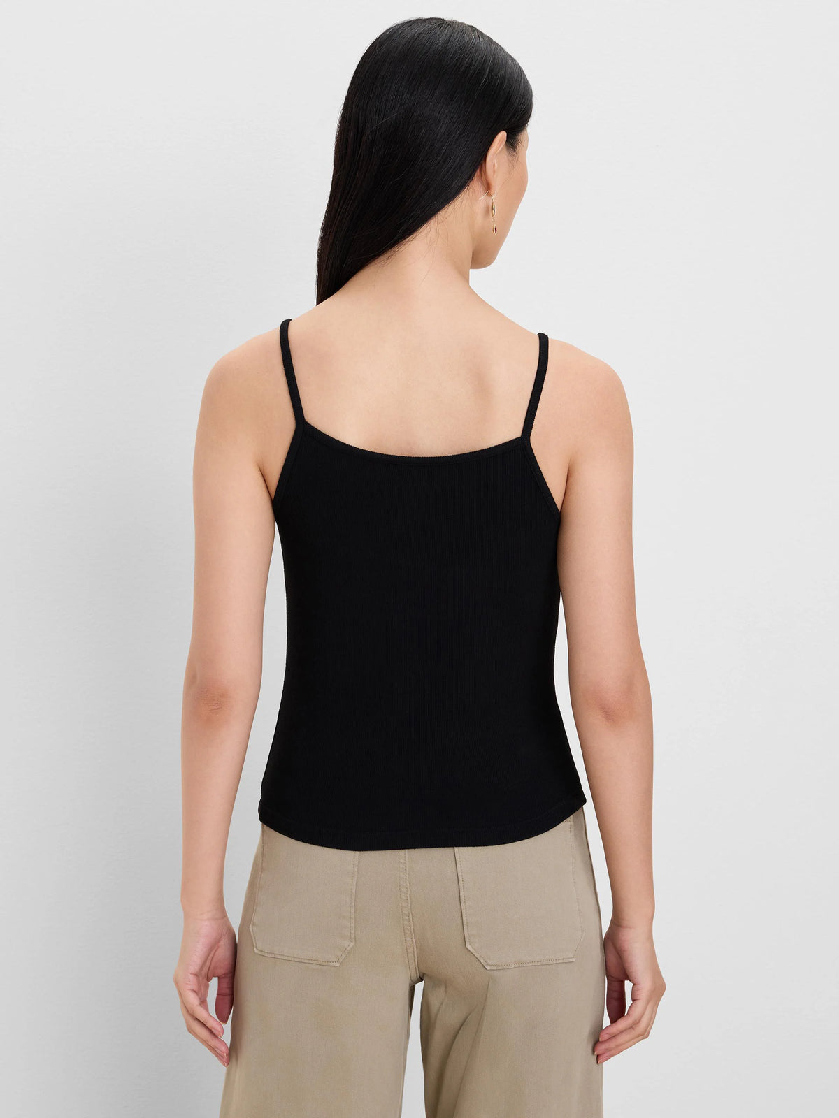 Black ribbed knit cami with thin straps and a square back neckline, modeled from behind.