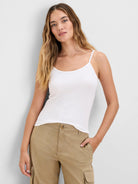 White slinky rib knit camisole with thin spaghetti straps.