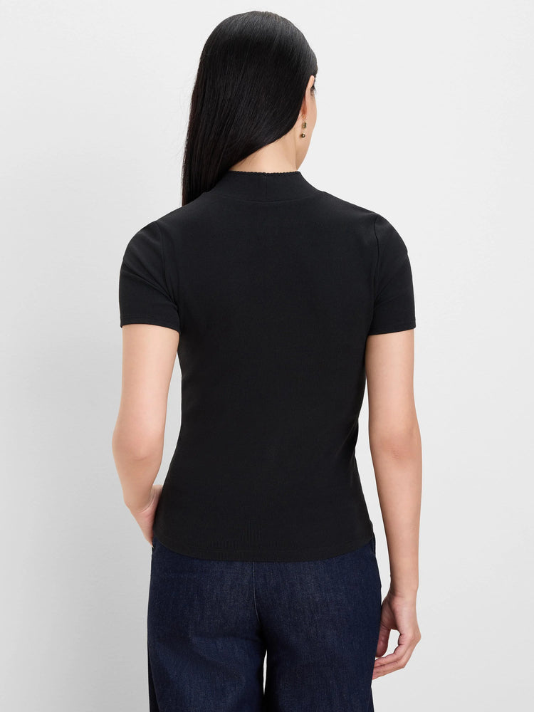 Black short-sleeve rib knit mockneck top on a model, shown from the back.