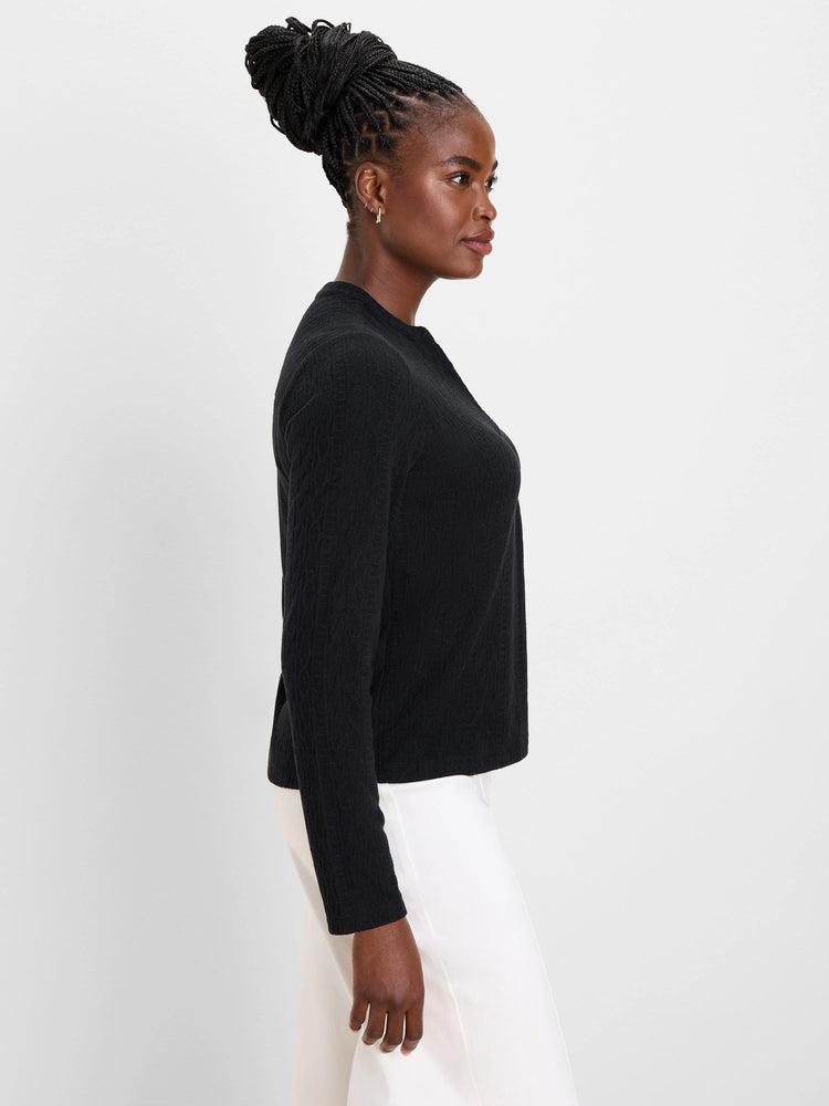 Black long-sleeve cable knit top with a split neck.