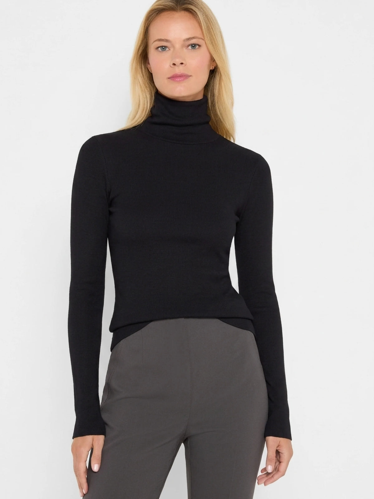 Black fitted long-sleeve rib knit turtleneck.