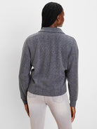 Dark grey cable knit pullover top with a collar, shown from the back.