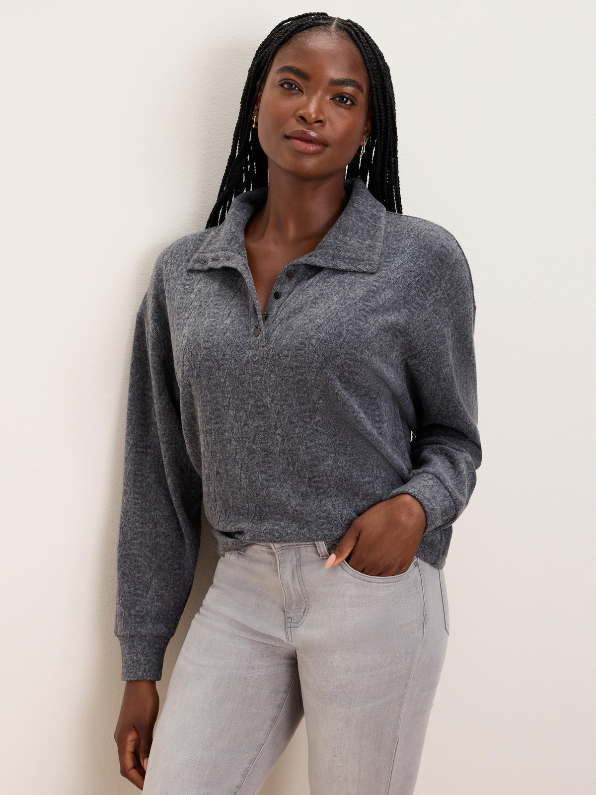 Dark gray textured knit pullover with a collar and three-button placket.