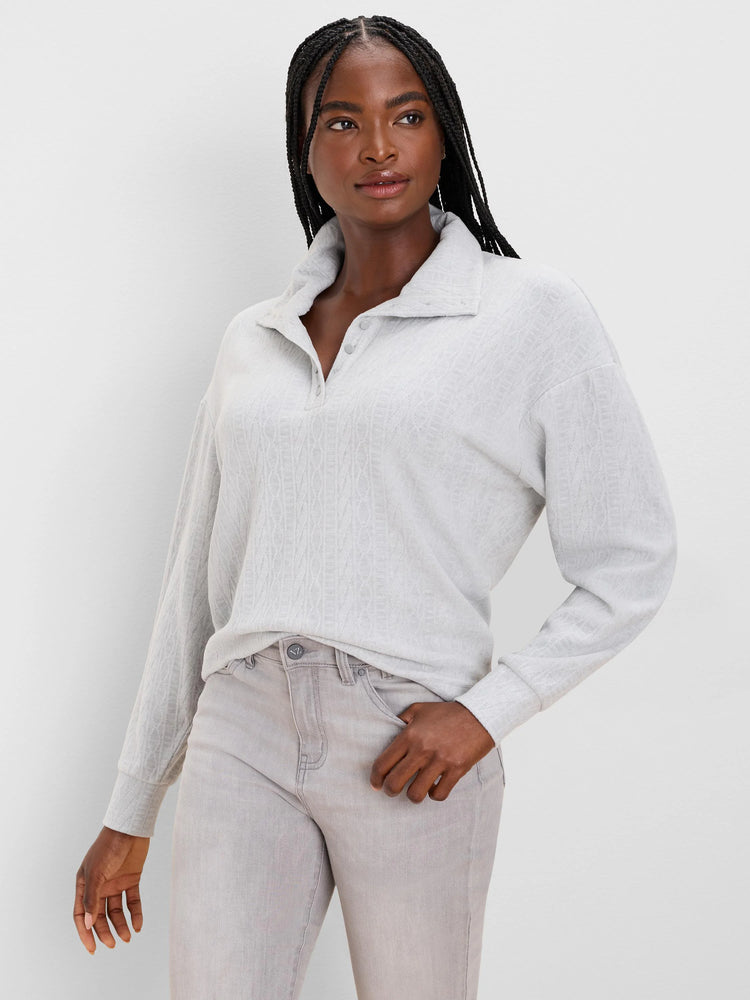Light gray cable knit pullover top with a collar and 3-button placket.