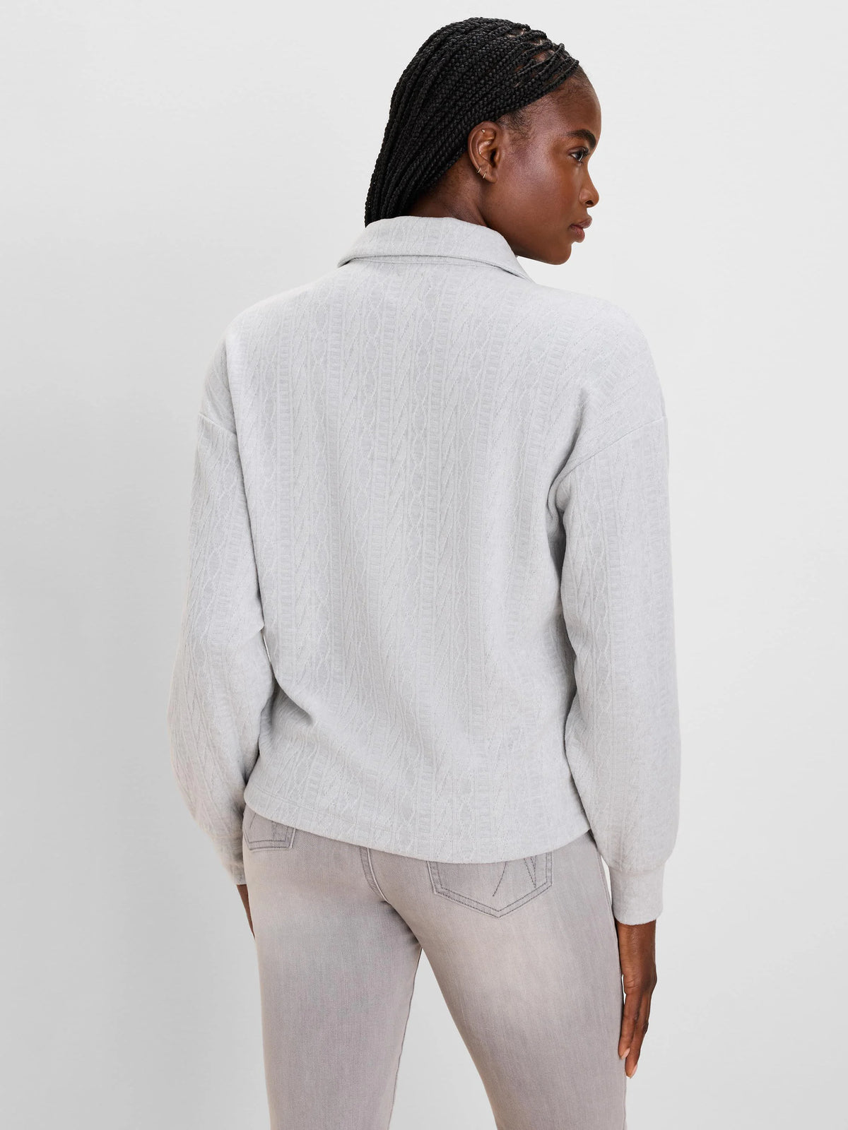 Light grey cable knit pullover with a stand-up collar.