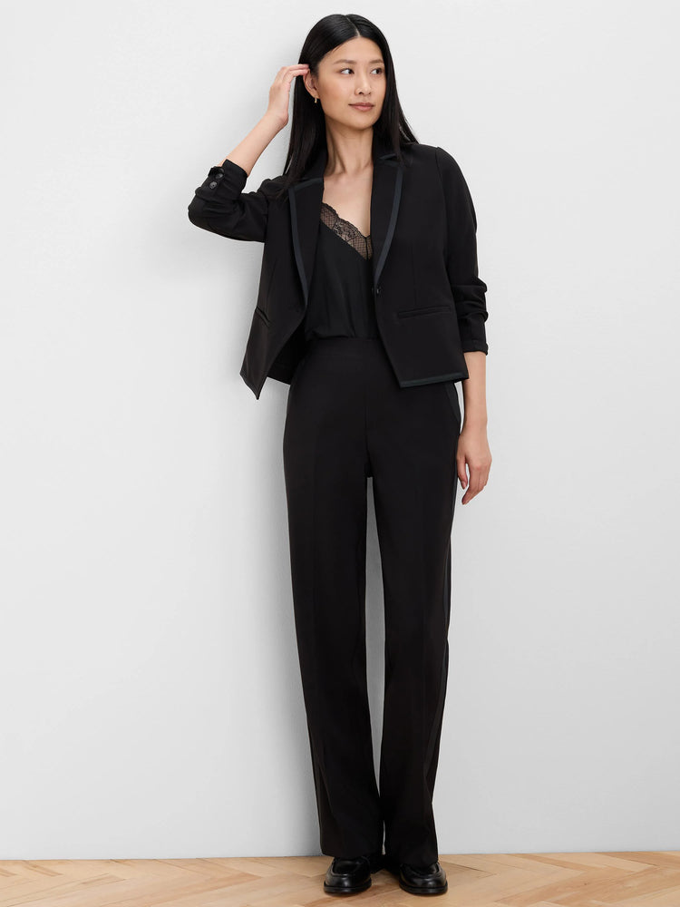 Black cropped blazer with grosgrain trimmed notched lapels.