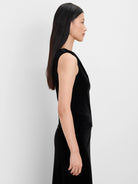 Black velvet drape neck tank, side view on model.
