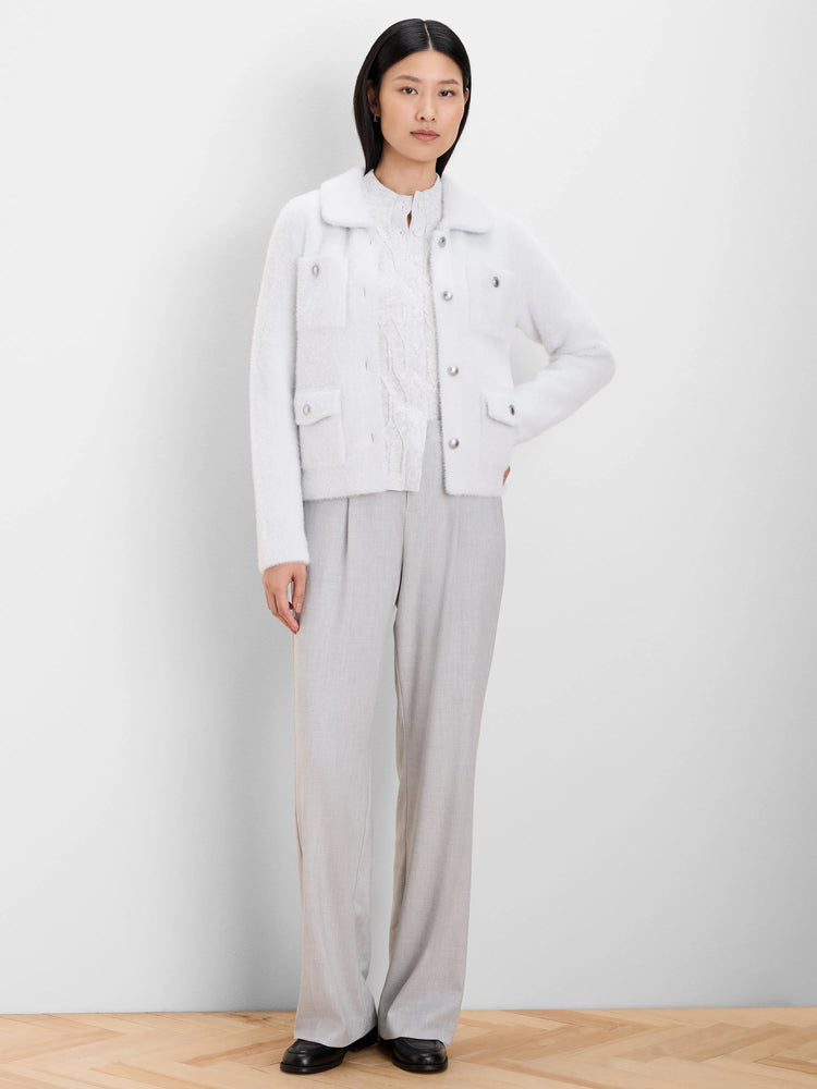 Light blue fuzzy collared jacket with silver-tone buttons and four front patch pockets.