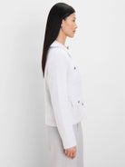 Light blue fuzzy collared jacket with two chest patch pockets featuring silver hardware.