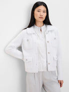 Off-white fuzzy jacket with a collar, four front patch pockets, and silver buttons.