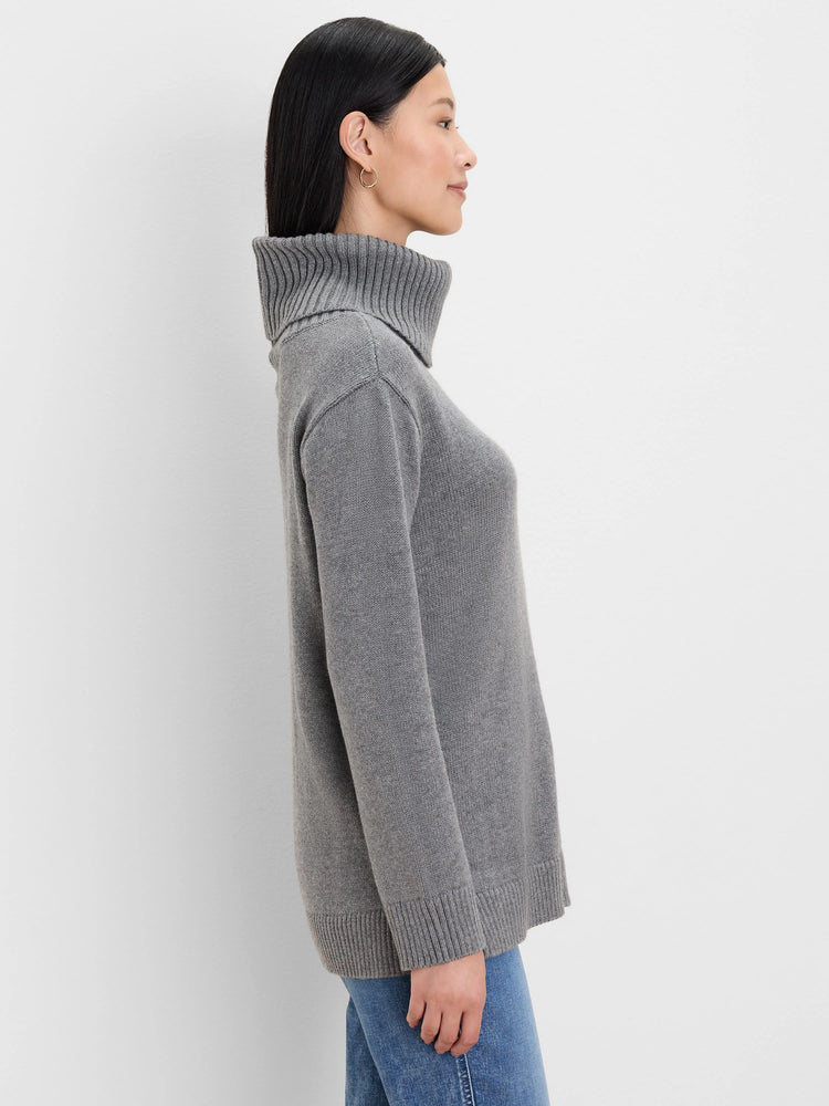 Grey foldover turtleneck sweater with ribbed turtleneck, cuffs, and hem.