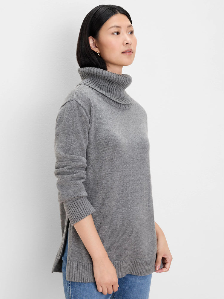 Grey foldover turtleneck sweater with a relaxed fit, ribbed cuffs and hem, and side slits.