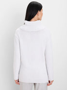 Light grey knit sweater, back view. Features a ribbed foldover turtleneck, long sleeves, and ribbed cuffs and hem.