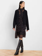 Black short cardigan jacket with braided Latigo lace trim along the open front, neckline, and patch pockets.
