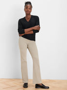 Black V-neck sweater with subtle sparkle knit texture.