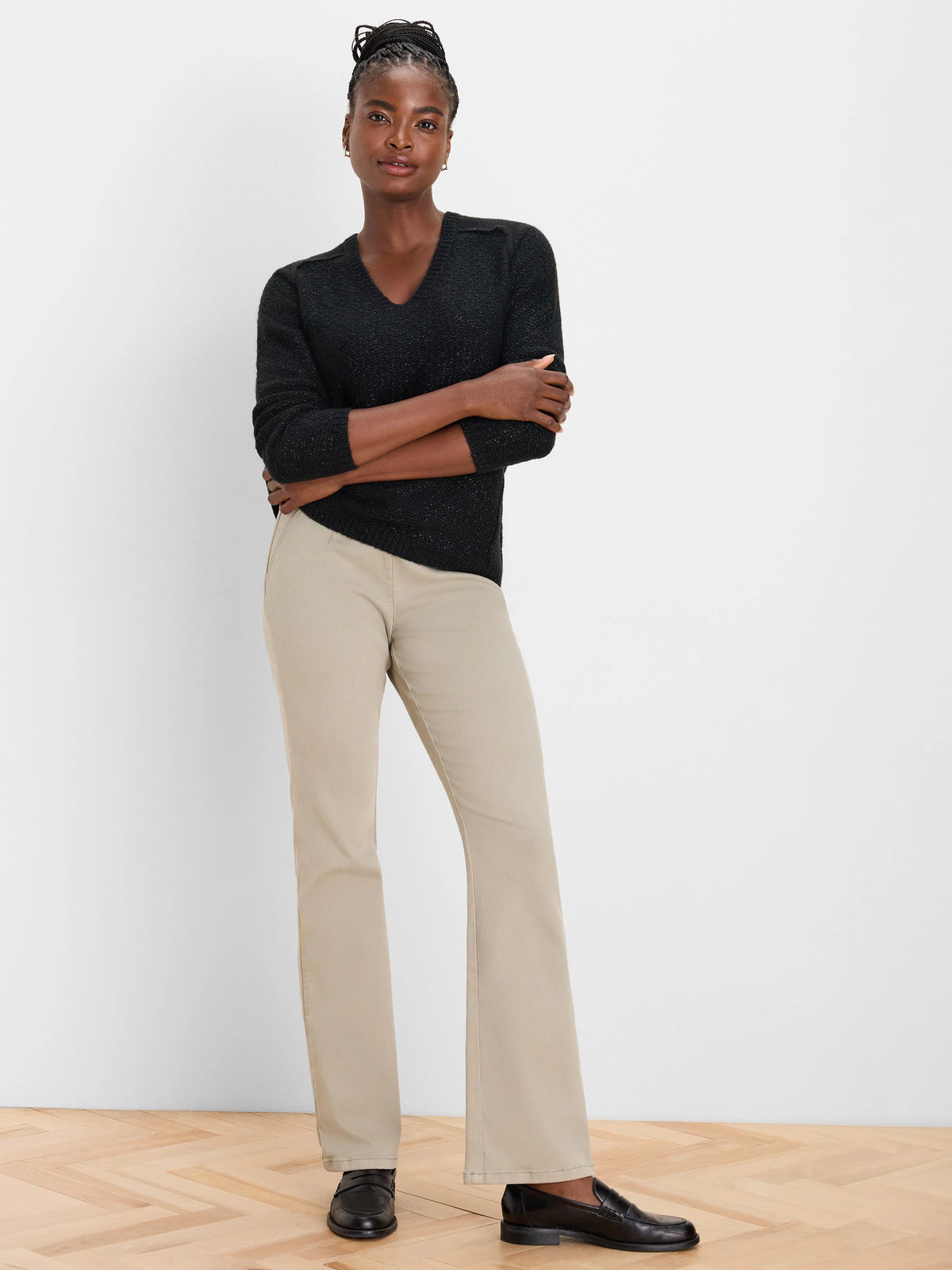 Black V-neck sweater with subtle sparkle knit texture.