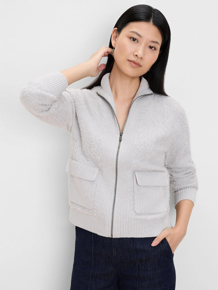 Light grey loopy knit jacket with ribbed collar, cuffs, hem, zipper front, and two flap pockets.