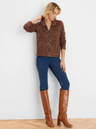 Brown knit jacket with scattered gold sequins, a zippered front, and a stand collar.