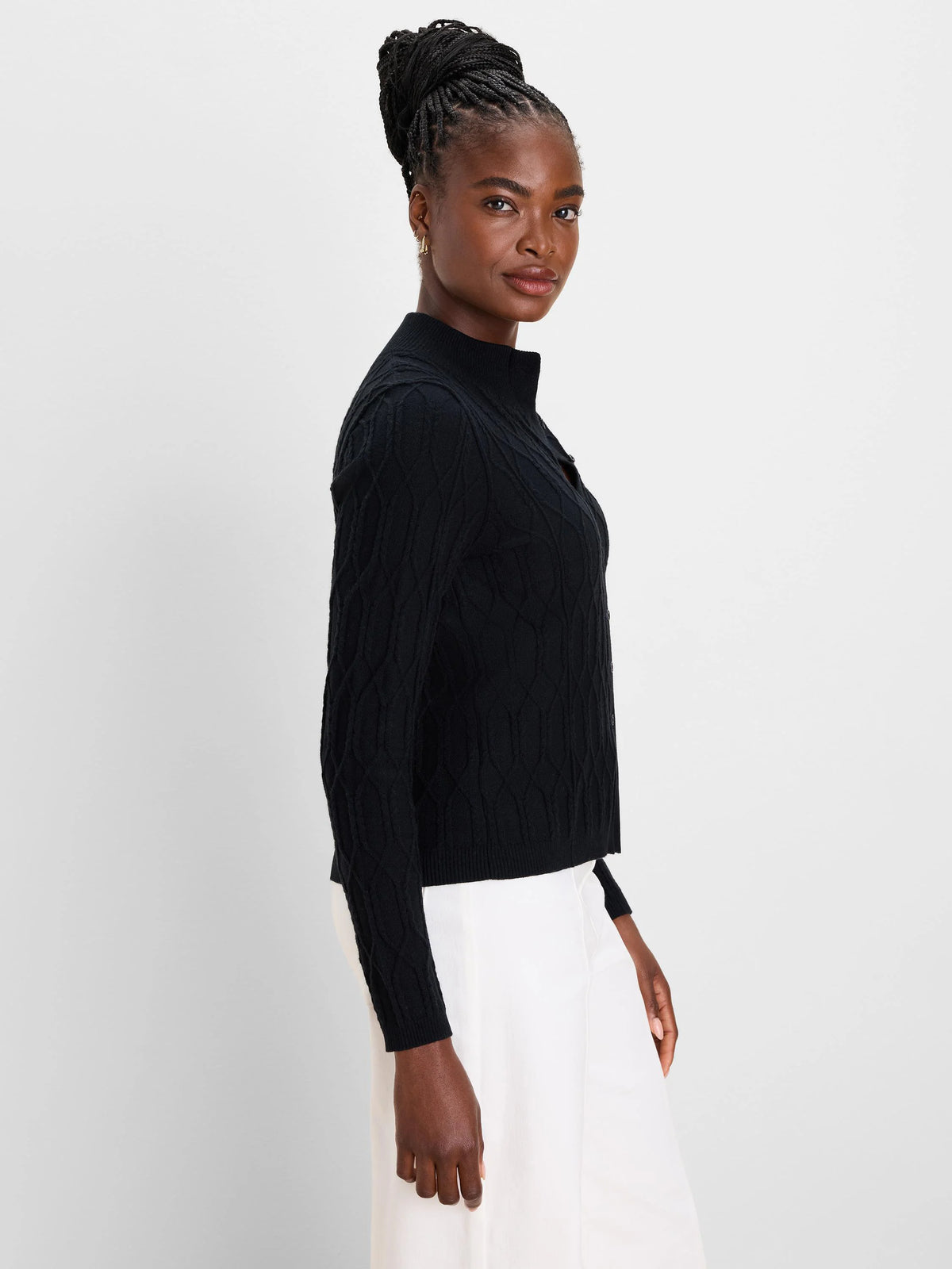 Black cable knit mockneck cardigan with front buttons.