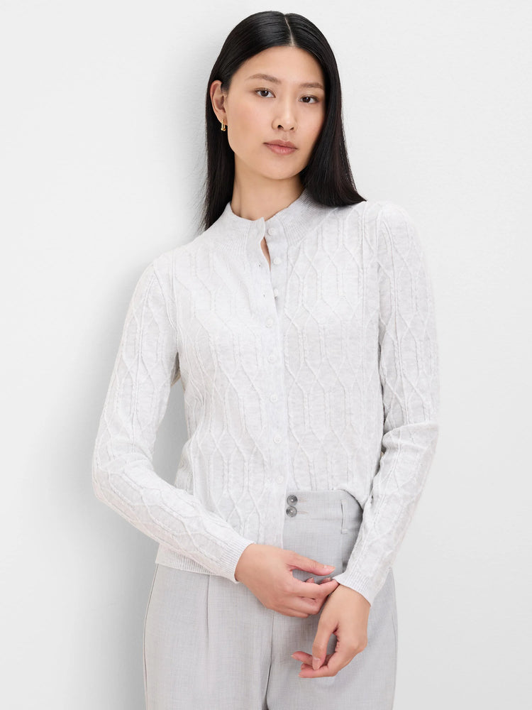 Light grey cable knit mockneck cardigan with front buttons.