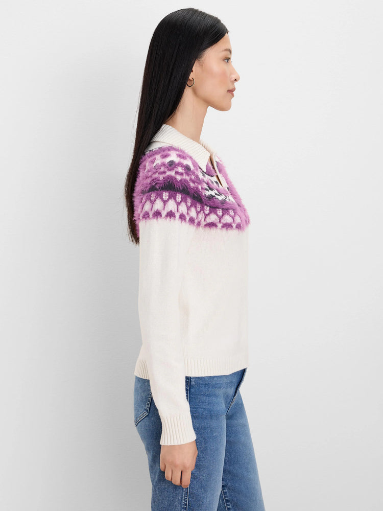 Cream Fairisle polo sweater with purple, black, and white fuzzy pattern across the shoulders and a polo collar.