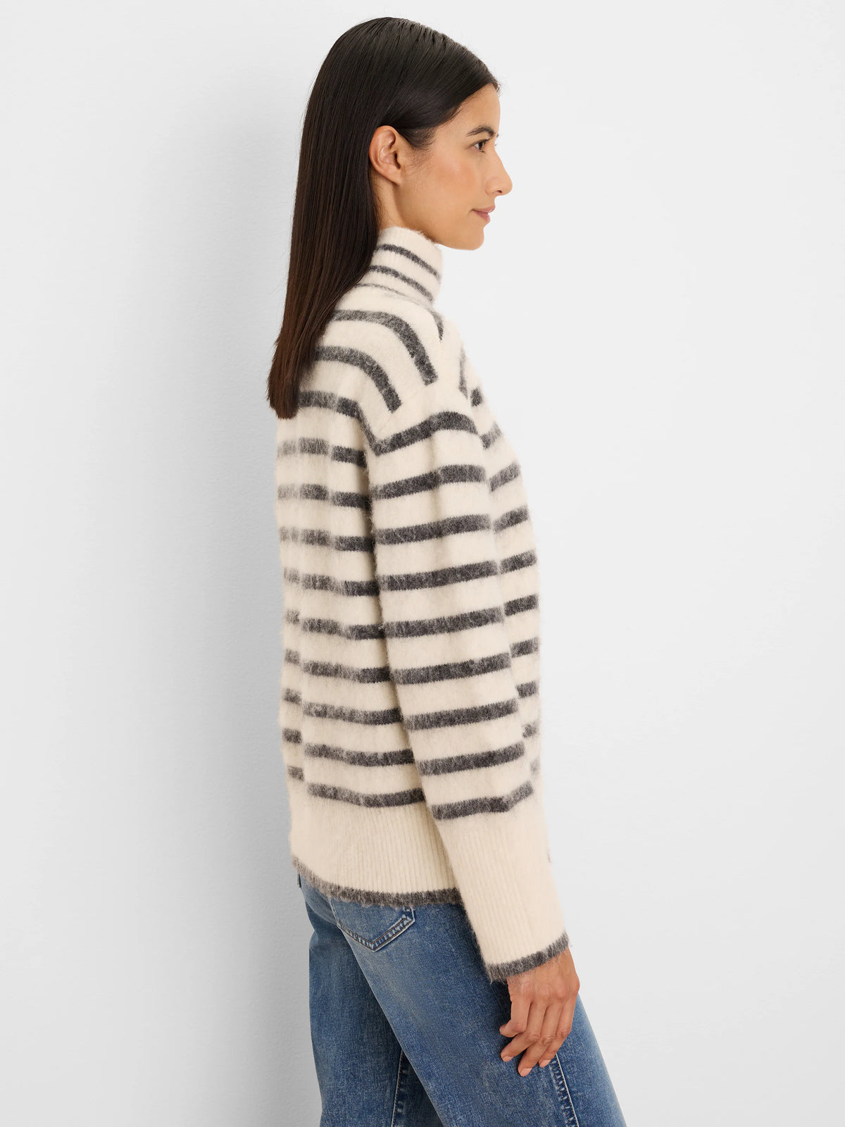 Cream brushed sweater with dark gray horizontal stripes and a mock neck.