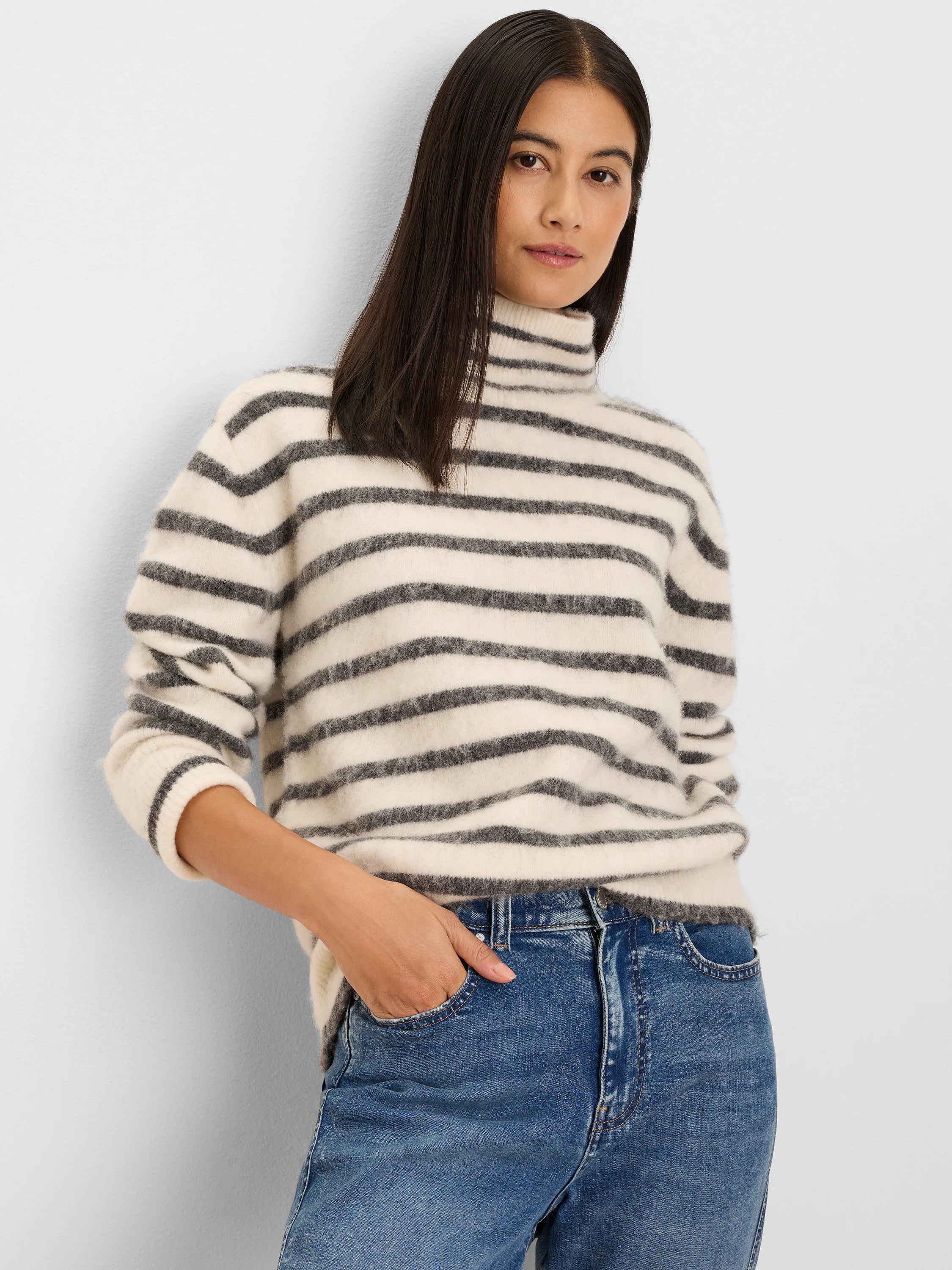 Cream brushed turtleneck sweater with dark gray horizontal stripes.
