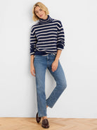 Brushed navy and white horizontal stripe turtleneck sweater.