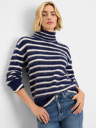 Navy and cream horizontal striped brushed turtleneck sweater.