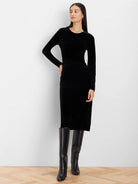 Black velvet long-sleeve midi dress with a round neck and gathered detail at the waist.