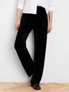 Black velvet wide-leg pants with a soft sheen.