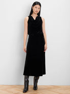 Black velvet slip skirt. Midi-length, straight silhouette.