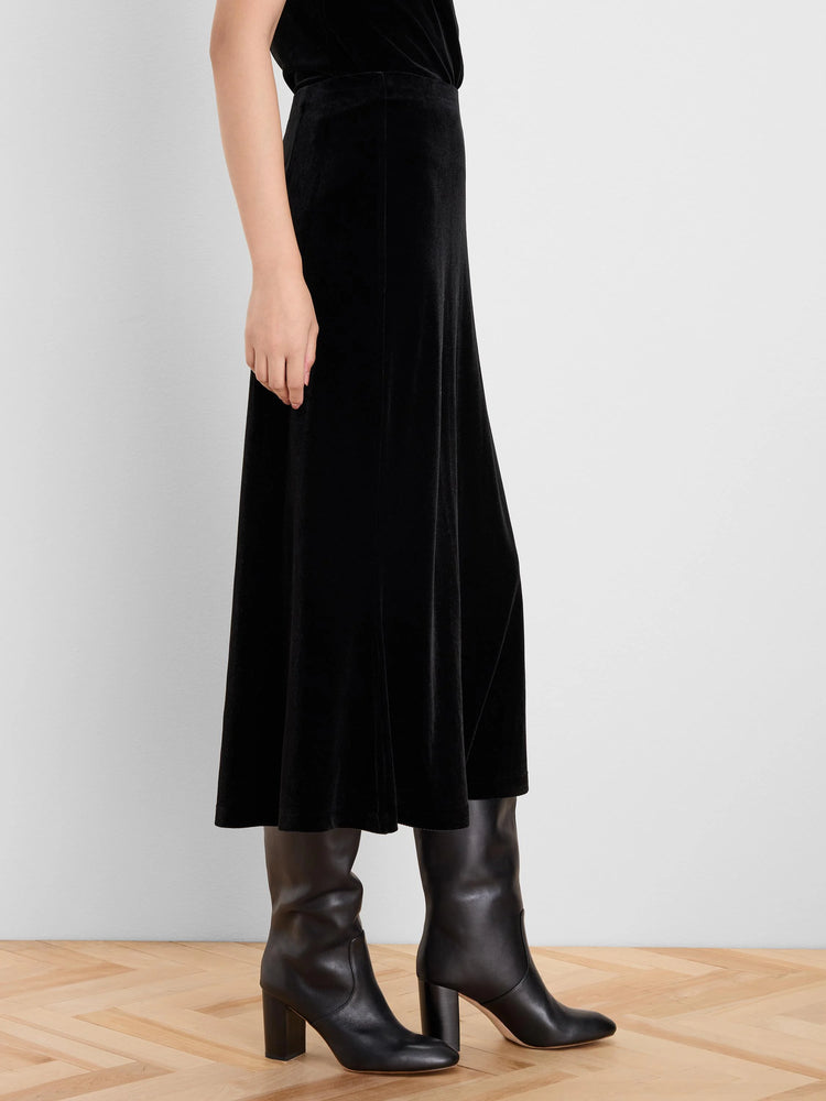 Black velvet slip skirt, midi length, with a subtle sheen and gentle flare.