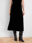 Black velvet midi slip skirt with a subtle A-line flare.