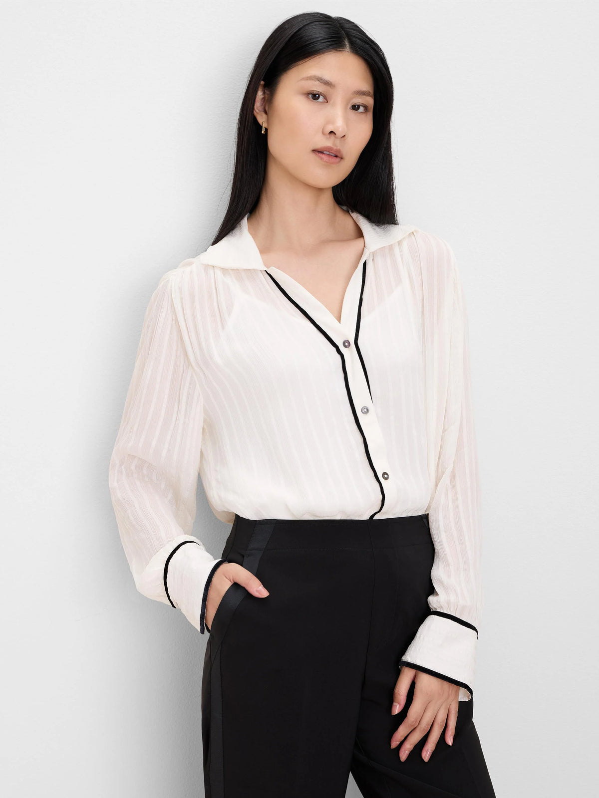 Cream sheer striped shirt with black velvet trim on the button placket and wide cuffs.