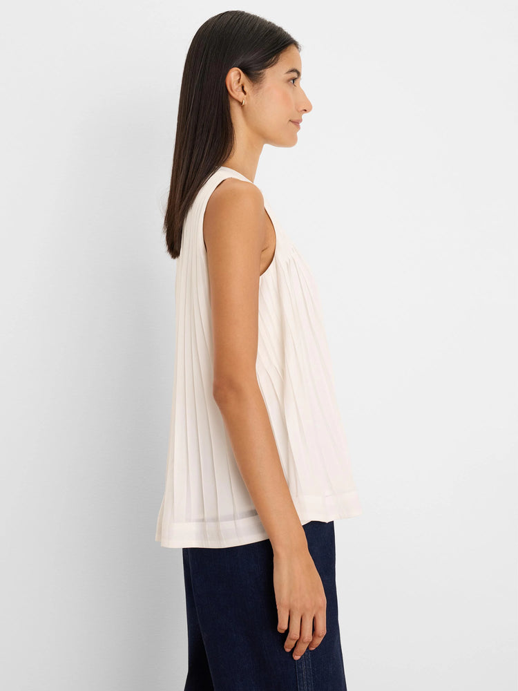Light cream sleeveless chiffon babydoll tank top with vertical pleats and a loose fit.