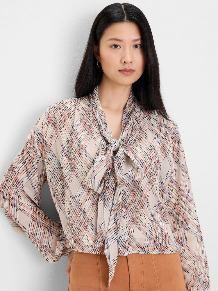Sheer light blouse with a multi-color painted plaid pattern in pink, purple, peach, and black. Has a tie neck.