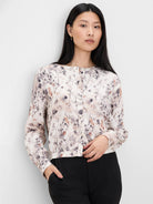 Light cream button-front shirt with long sleeves, featuring an abstract print in shades of grey, black, and dusty pink.