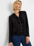 Black long-sleeve shirt with ruffles flanking the white button-front placket and a band collar.