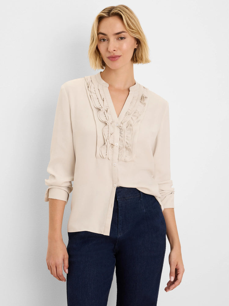 Light beige shirt with a ruffled placket, band collar, and button front. Cuffed long sleeves.
