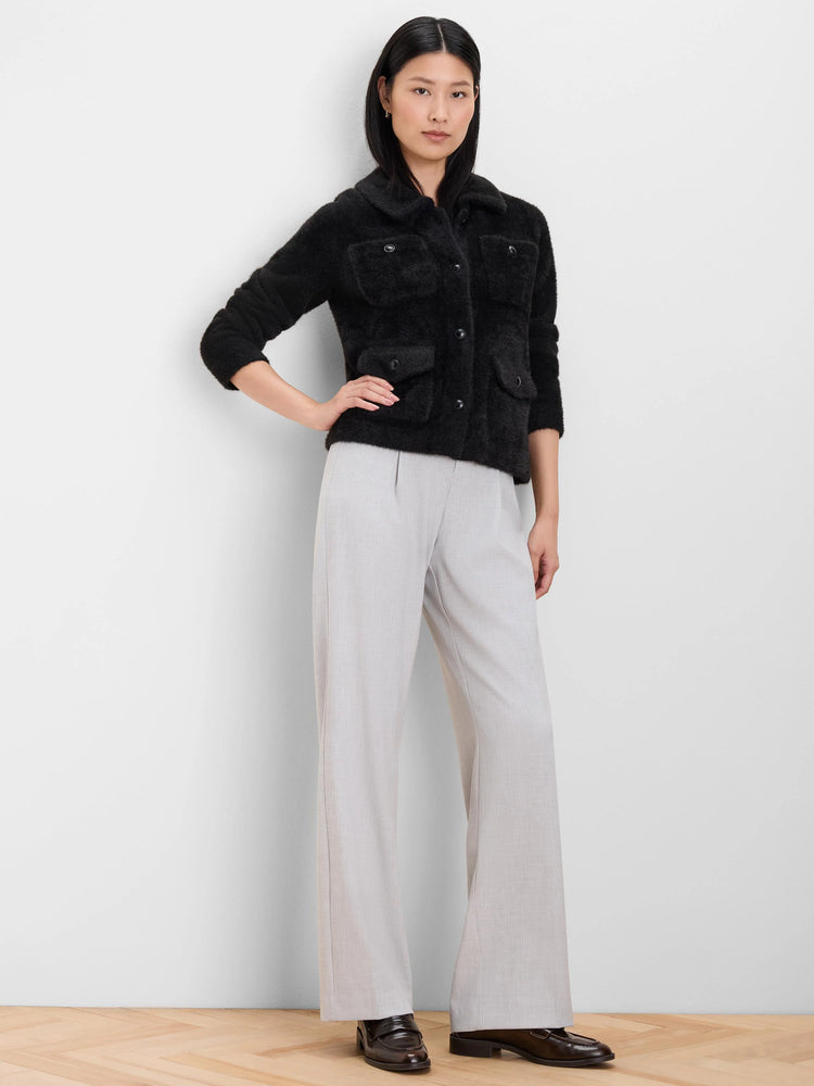 Light gray wide leg crepe trousers with front pleats, worn by a model.