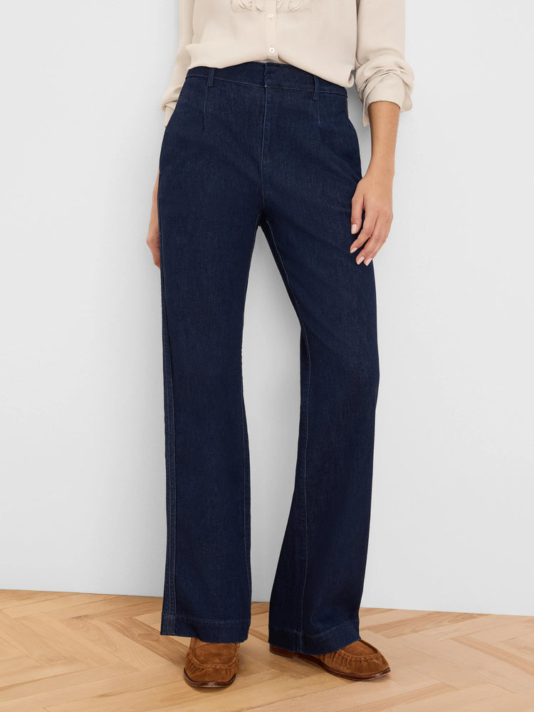 Dark indigo, wide-leg denim trousers with stitched front seams and hem.