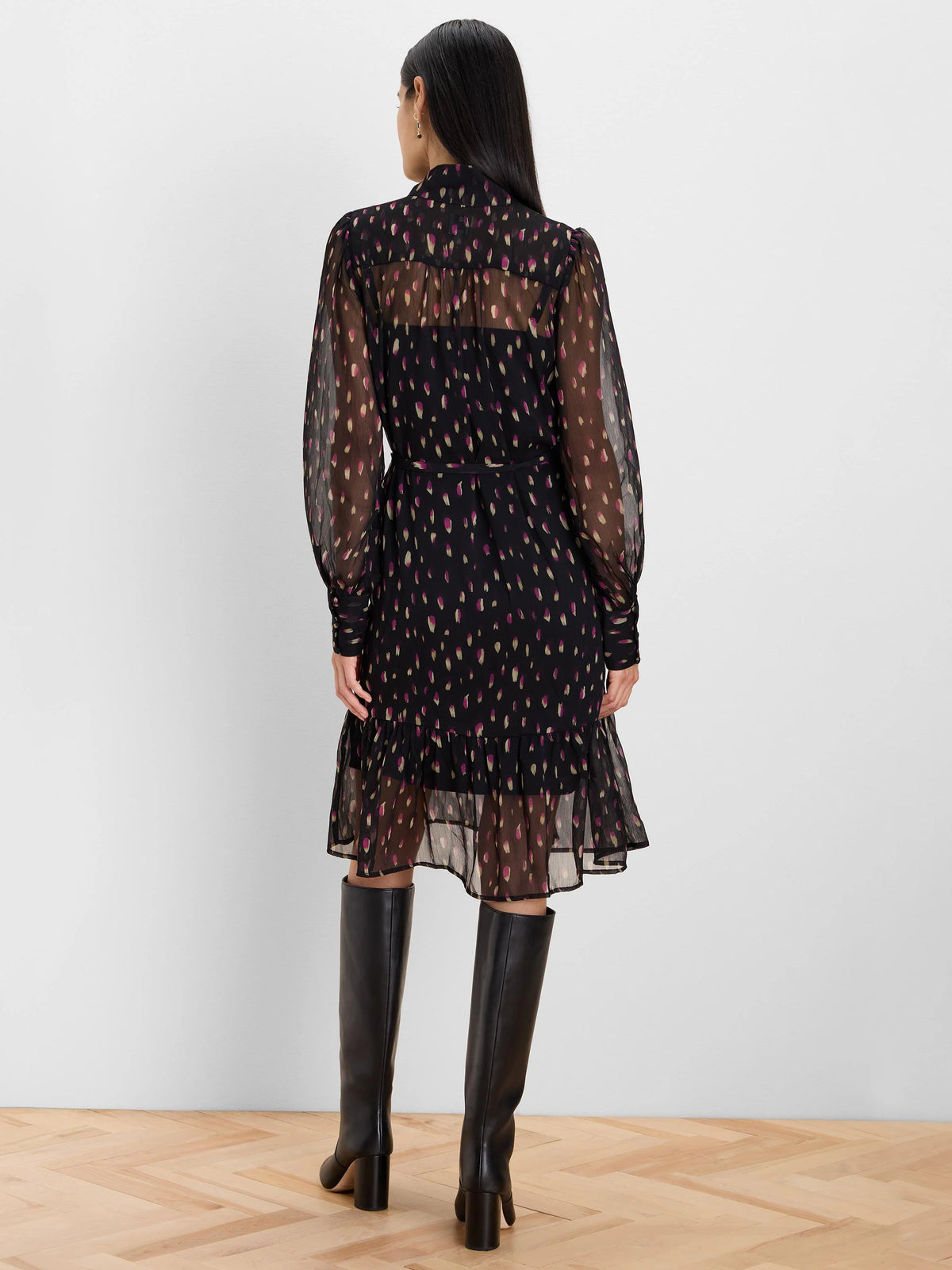 Black sheer long-sleeved dress with magenta & beige brushstroke spots, tie waist, and ruffled tiered midi hem.